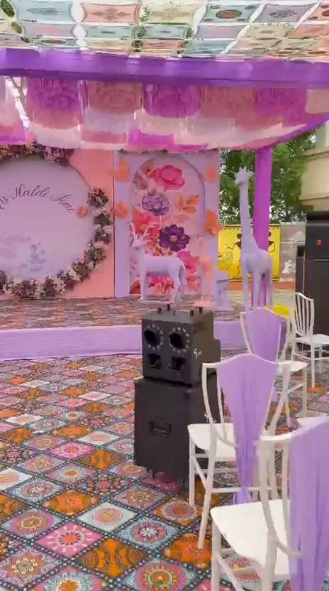 Pink celebration backdrop and colourful floor design